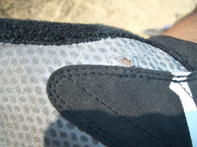 ...and here is a close-up of the start of the damage. The palm  material is way too thin!